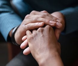 two people holding hands