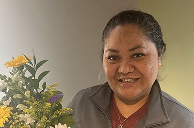 viva groom with flowers