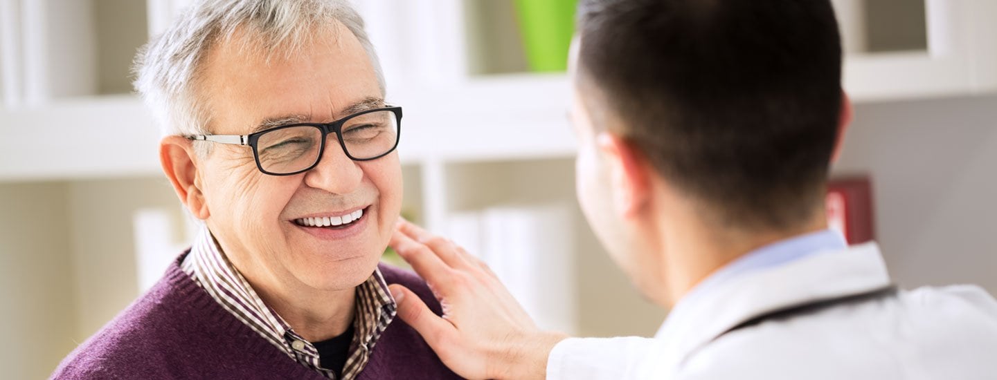 A doctor visiting with a patient