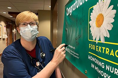 tina taylor next to daisy nurse banner