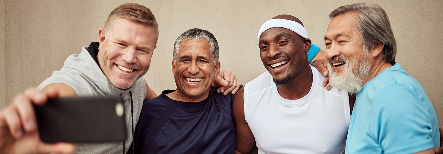 four men posing for a selfie