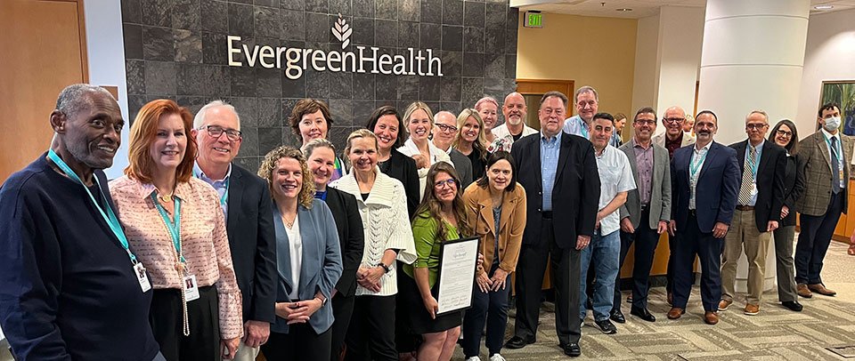 selected evergreenhealth and microsoft staff pictured standing in boardroom