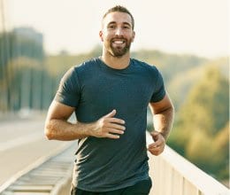 smiling man jogging