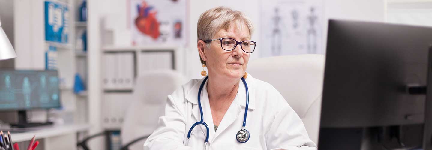 doctor looking at computer