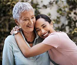 woman and daughter hugging