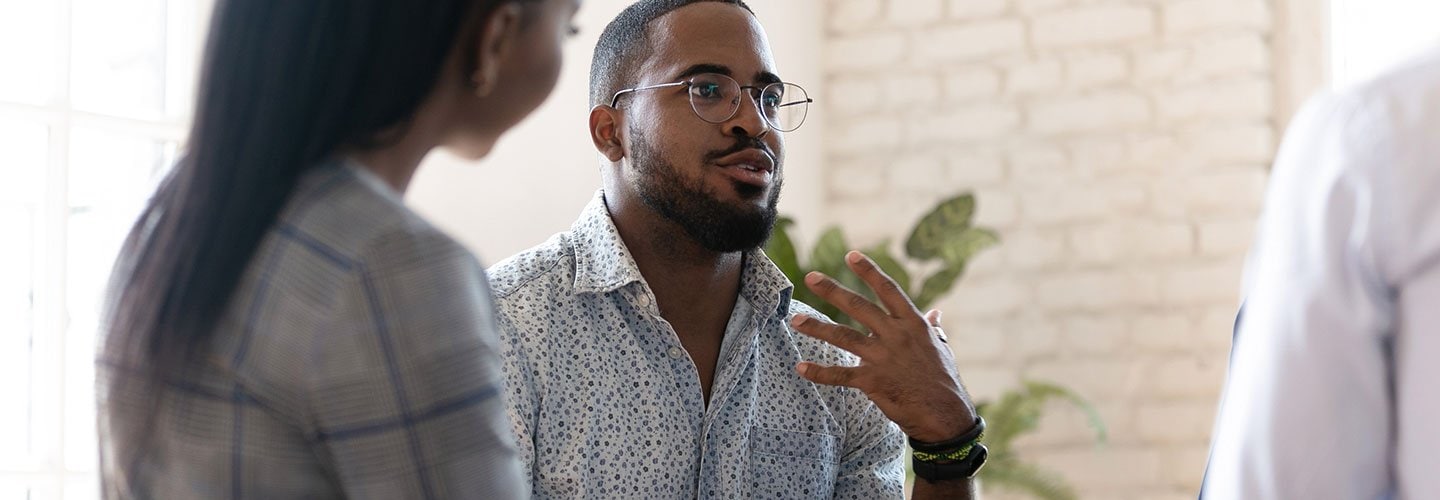 man gesturing in conversation