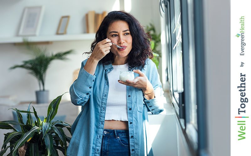 woman eating yogurt